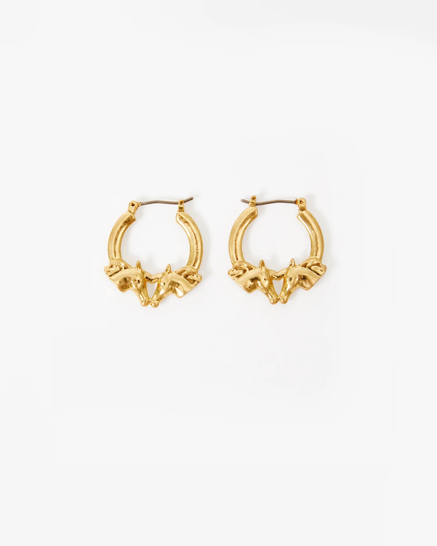 Gold hoop earrings on a white background