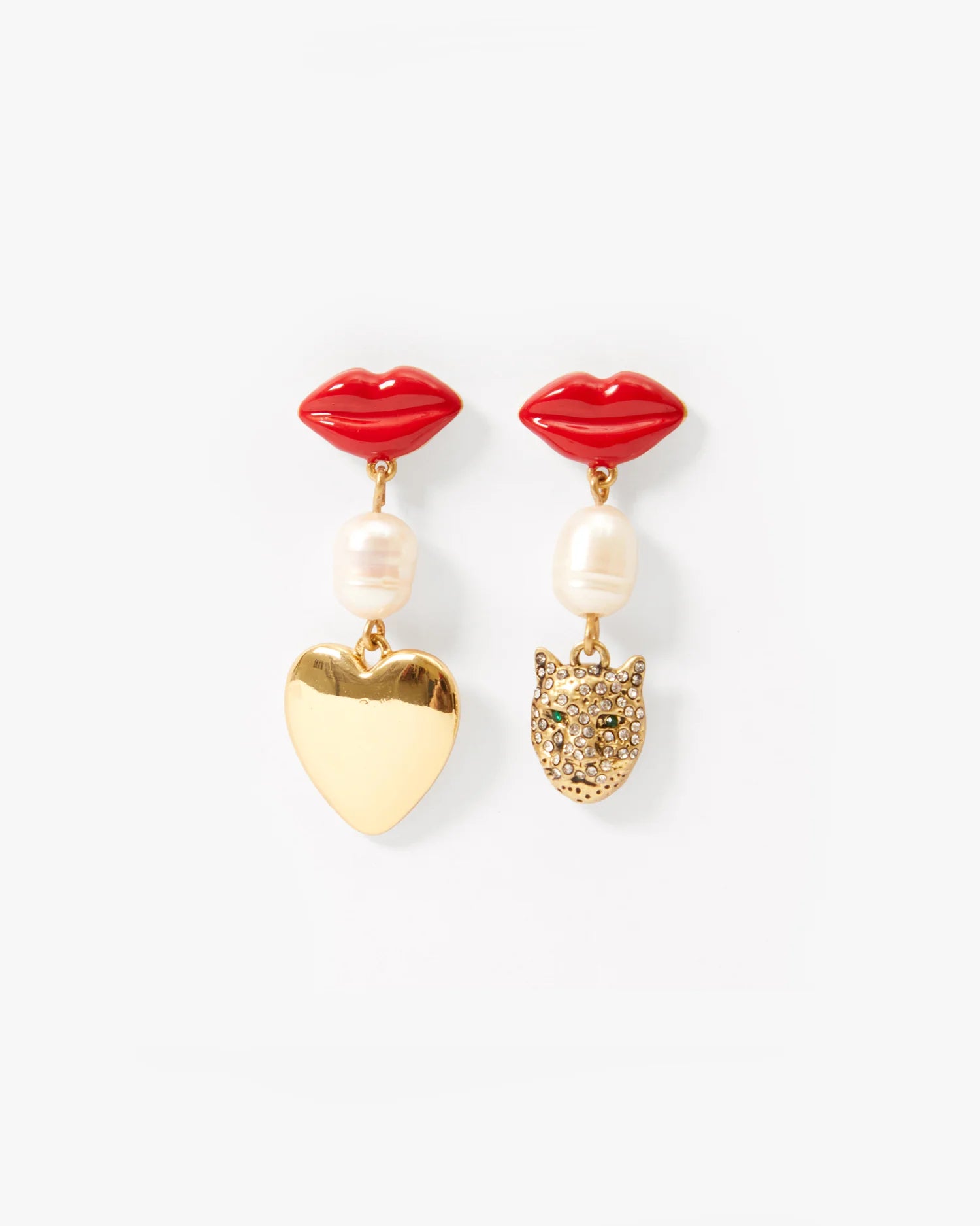 Pair of earrings with red lip-shaped tops, pearl beads, and gold heart and lion head charms on a white background.