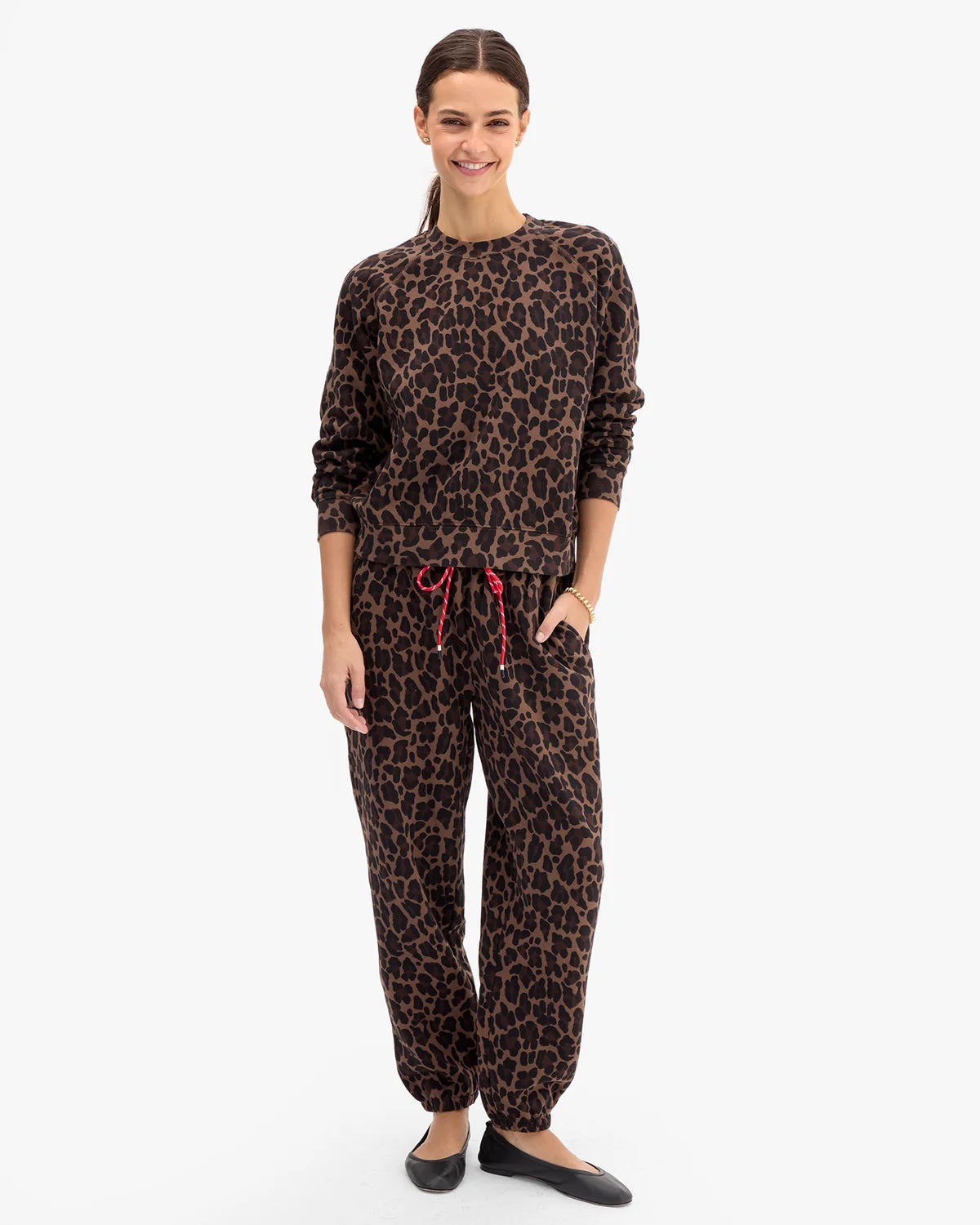 model wearing a matching leopard print sweatshirt set