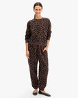 model wearing a matching leopard print sweatshirt set
