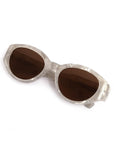 Sunglasses with brown lenses and silver frame on a white background