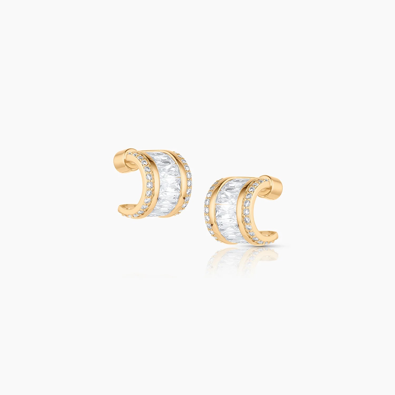 Gold earrings on a white background