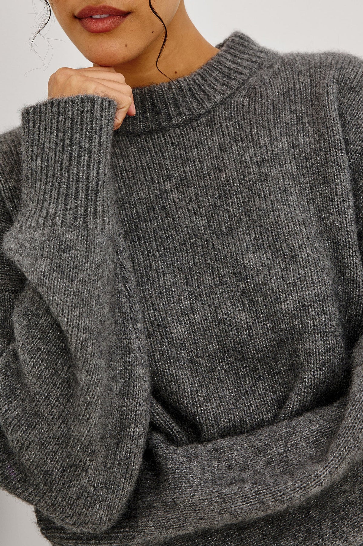 close up of model wearing a grey sweater