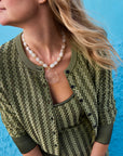 Claudia Necklace on model with green sweater