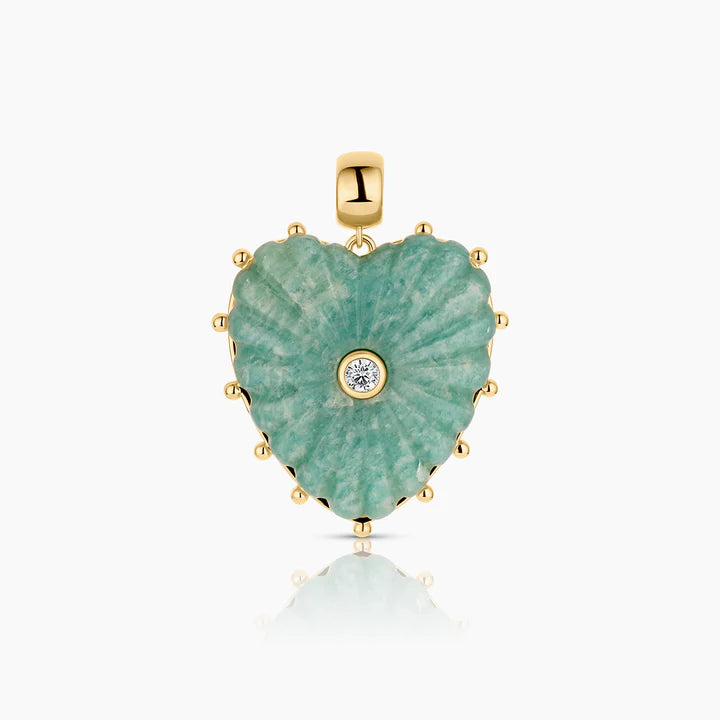 Heart-shaped pendant with green stone and gold accents on a white background
