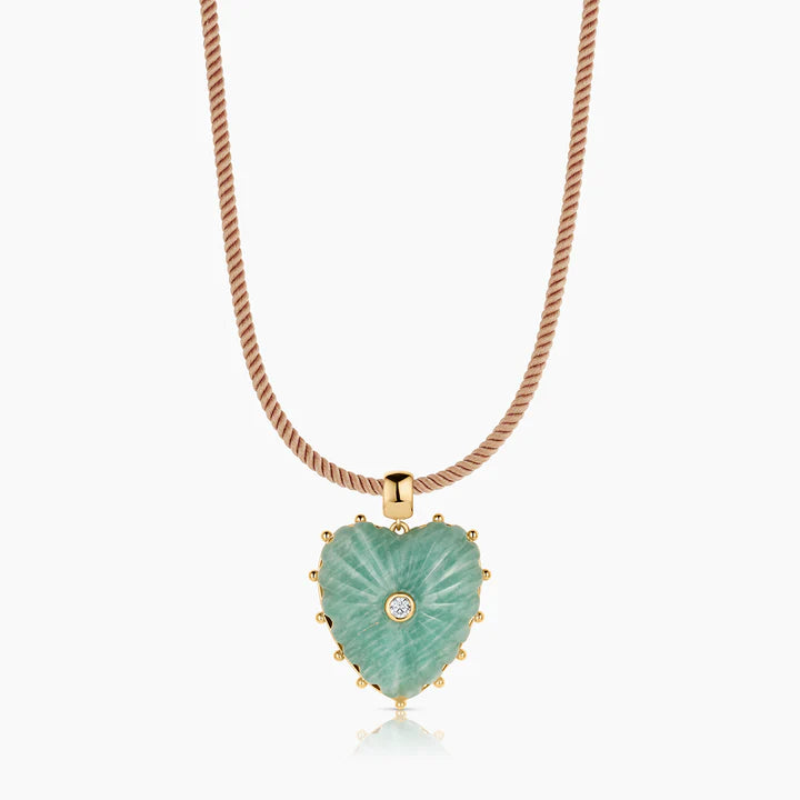 Heart-shaped green pendant necklace with rose gold chain on a white background