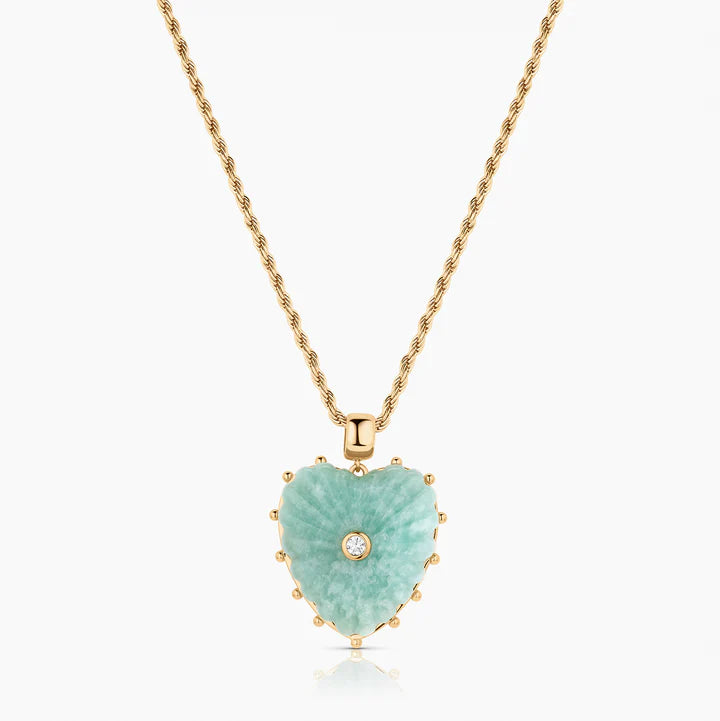 Heart-shaped pendant necklace with green stone and gold chain on a white background