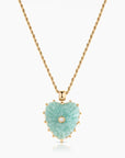 Heart-shaped pendant necklace with green stone and gold chain on a white background