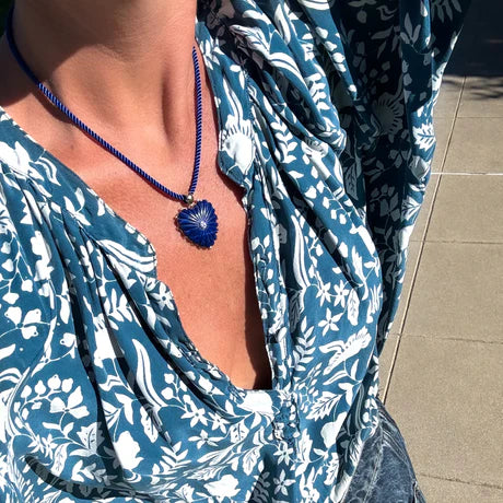 Coco Deep Sea Silk Cord Necklace with blue heart charm on model