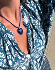 Coco Deep Sea Silk Cord Necklace with blue heart charm on model