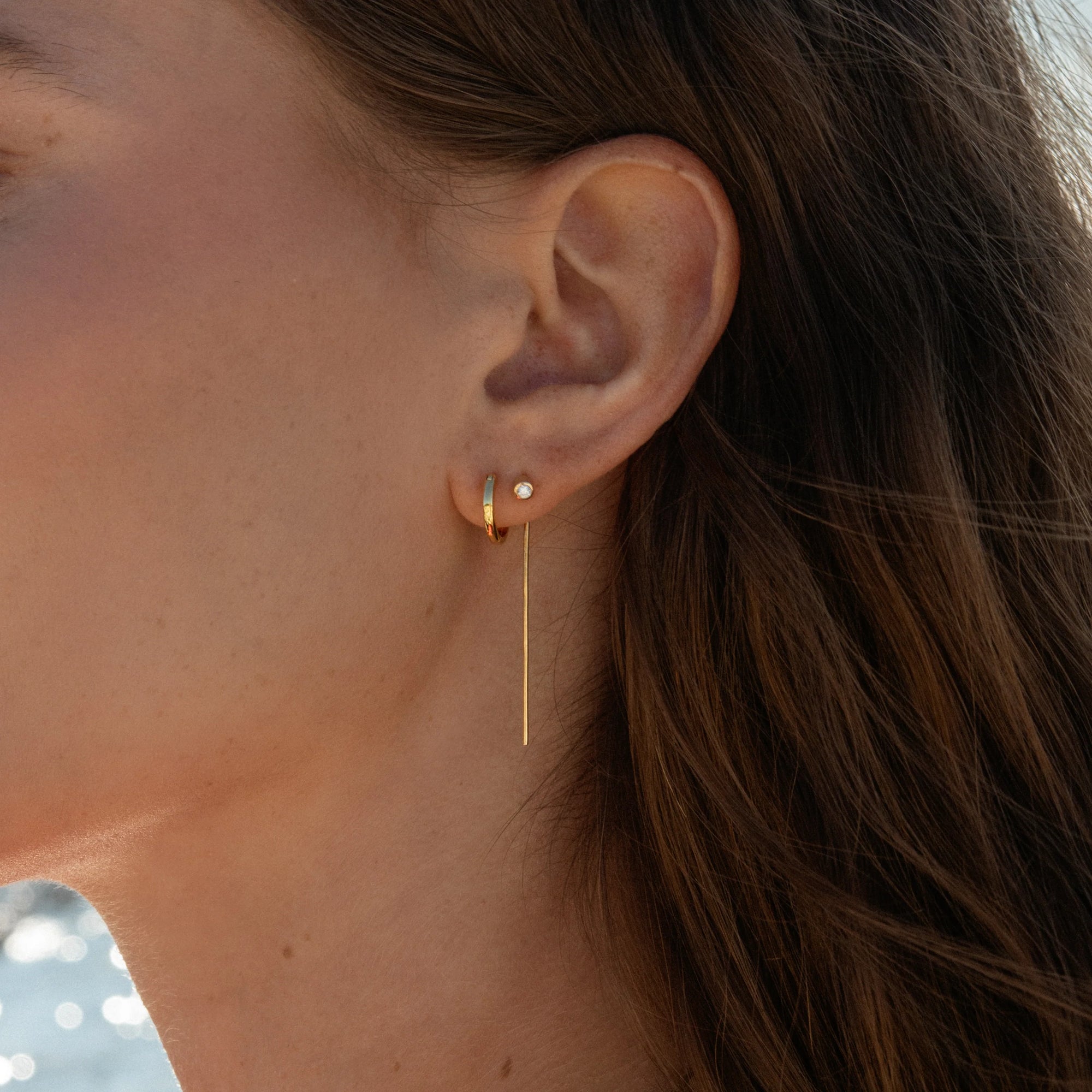 Marlo Threader Earrings on model with huggie hoop