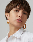 Mega U Link Earrings front view on model