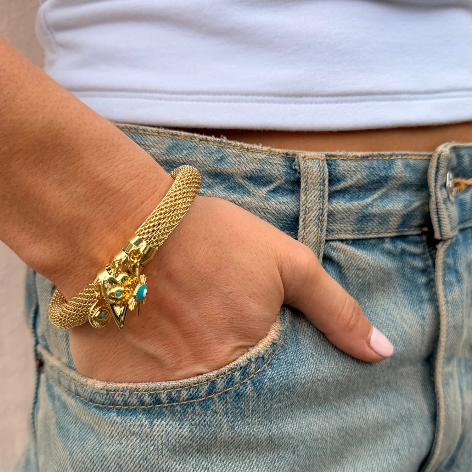Mesh Charm Bracelet on wrist, hand in pocket