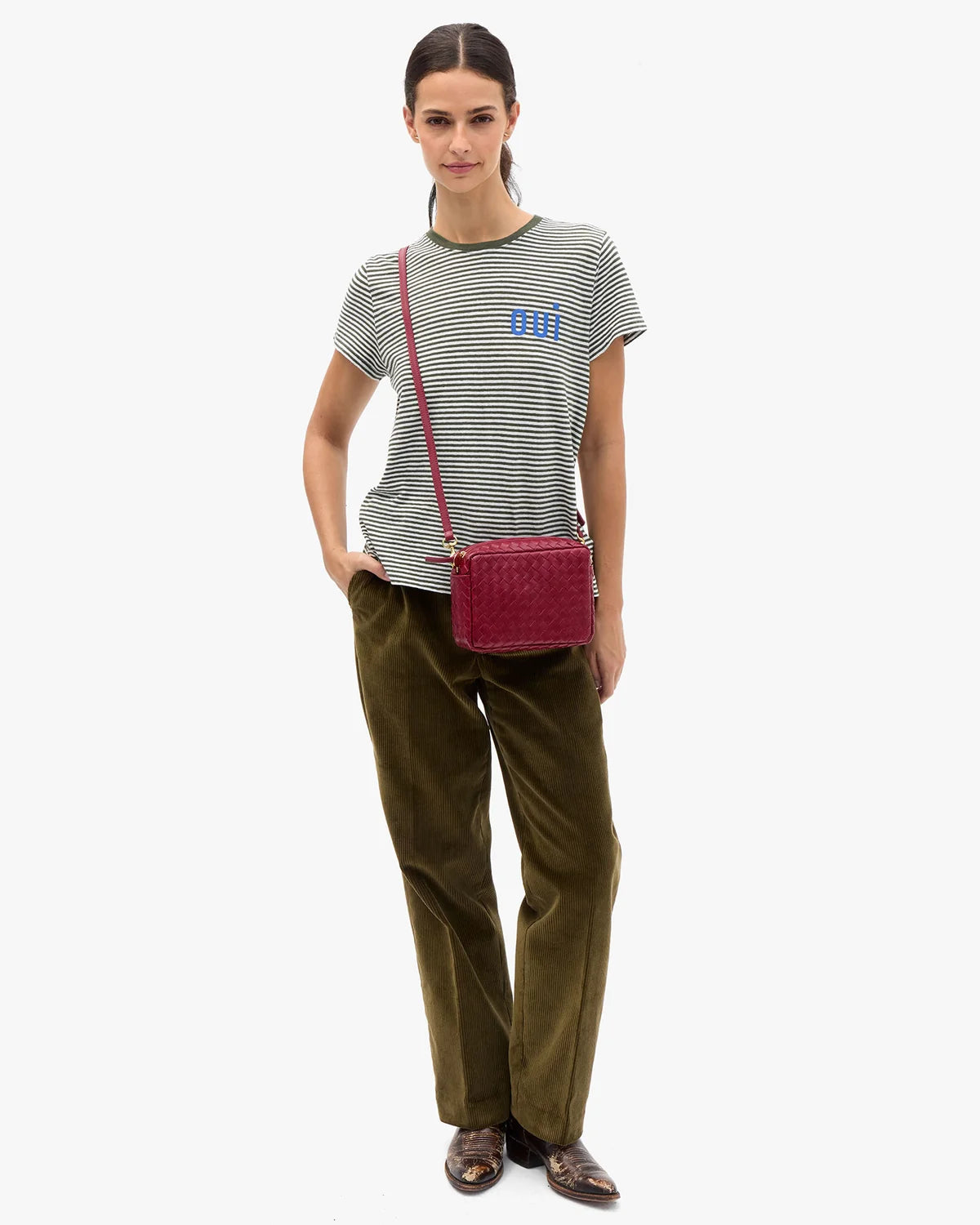 model wearing a striped tee with OUI on chest
