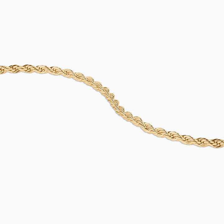Gold rope chain on a white background