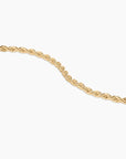 Gold rope chain on a white background