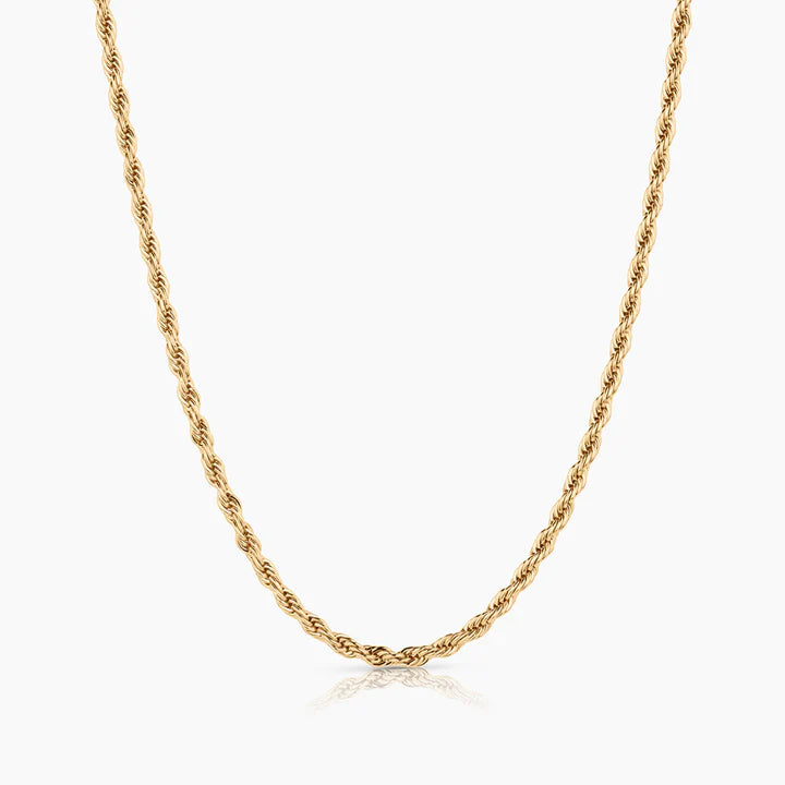 Gold chain necklace on a white background