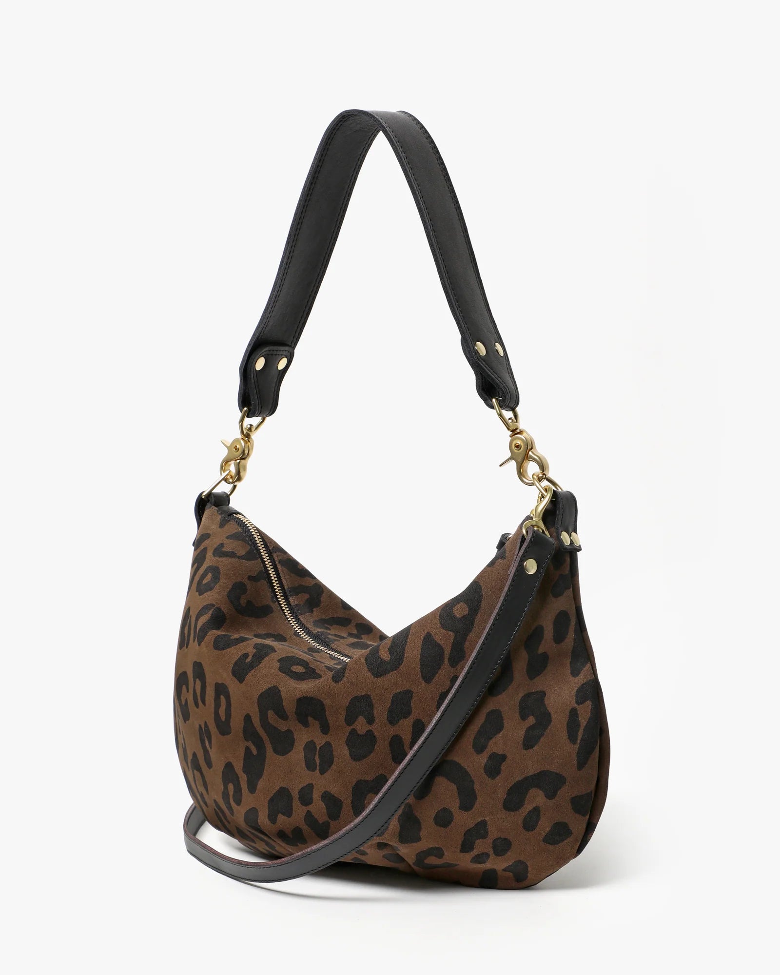 Leopard print handbag with black handle and strap on a white background