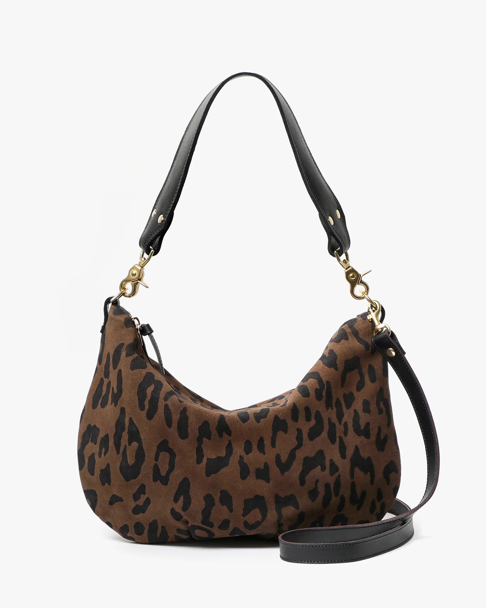 Leopard print handbag with black handle and strap on a white background