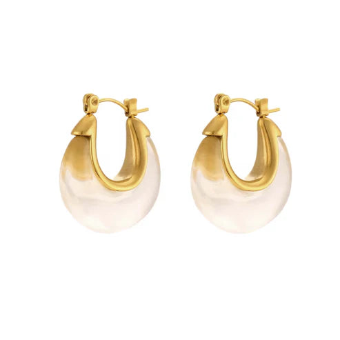 Gold hoop earrings with clear resin on a white background