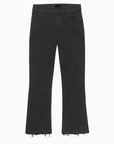 Black jeans with frayed hems on a white background