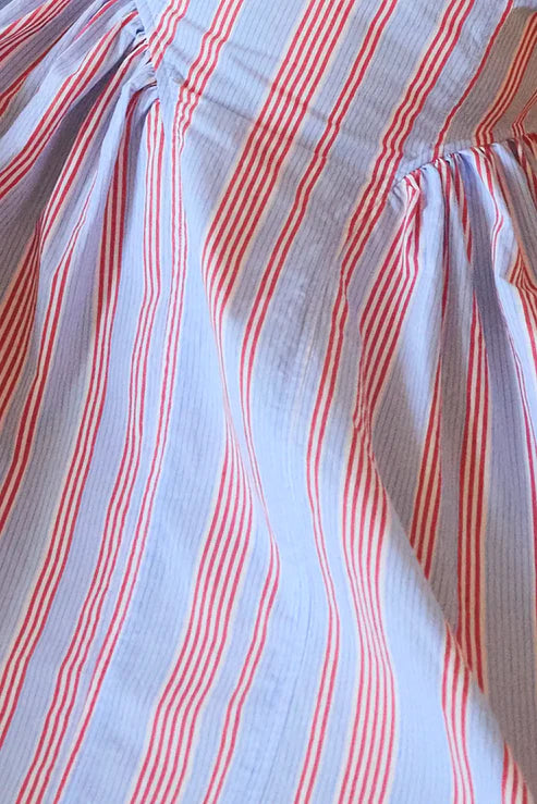 Close-up of fabric with red and blue wavy stripes