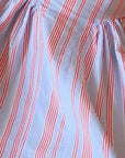 Close-up of fabric with red and blue wavy stripes