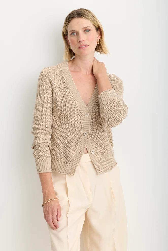 Raleigh Cardigan in Latte close up front view on model with one of her hands behind her neck