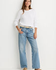 Raleigh Pullover in White full body front view on model with hand on hip