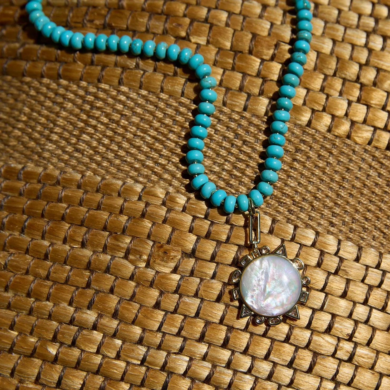 Semi-Precious Odyssey Necklace front view laying on woven surface