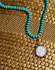 Semi-Precious Odyssey Necklace front view laying on woven surface