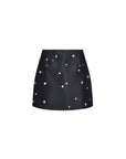 Black skirt with silver studs on a white background