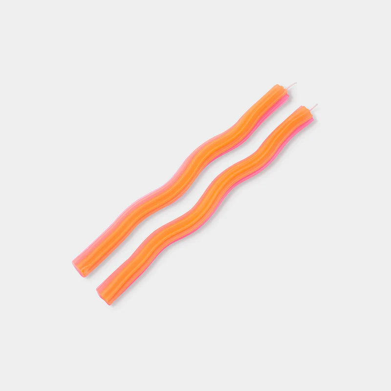 Two pink and orange striped earrings on a light gray background