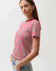 Woman wearing a red and white striped t-shirt against a plain background