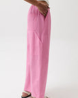 Person wearing pink pants on a white background