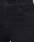 Close-up of black pants with a button and stitching detail.