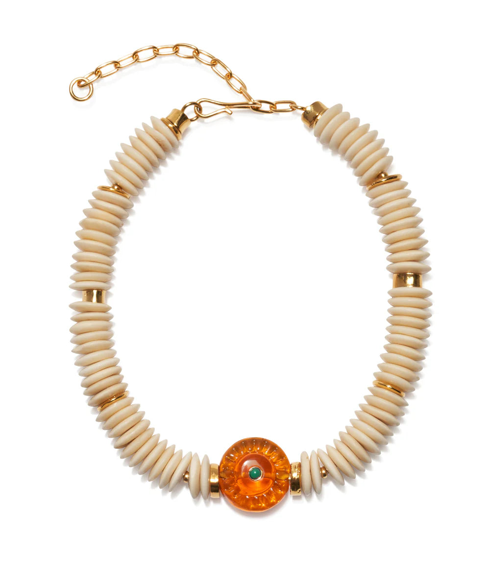 Necklace with beige beads and a large orange bead on a white background