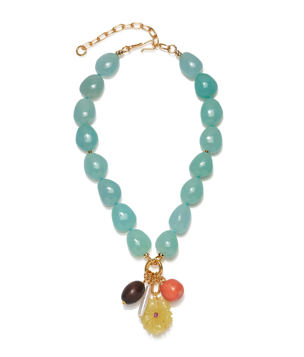 Beaded necklace with charms on a white background