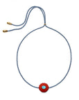 Necklace with a red flower pendant and blue cord on a white background