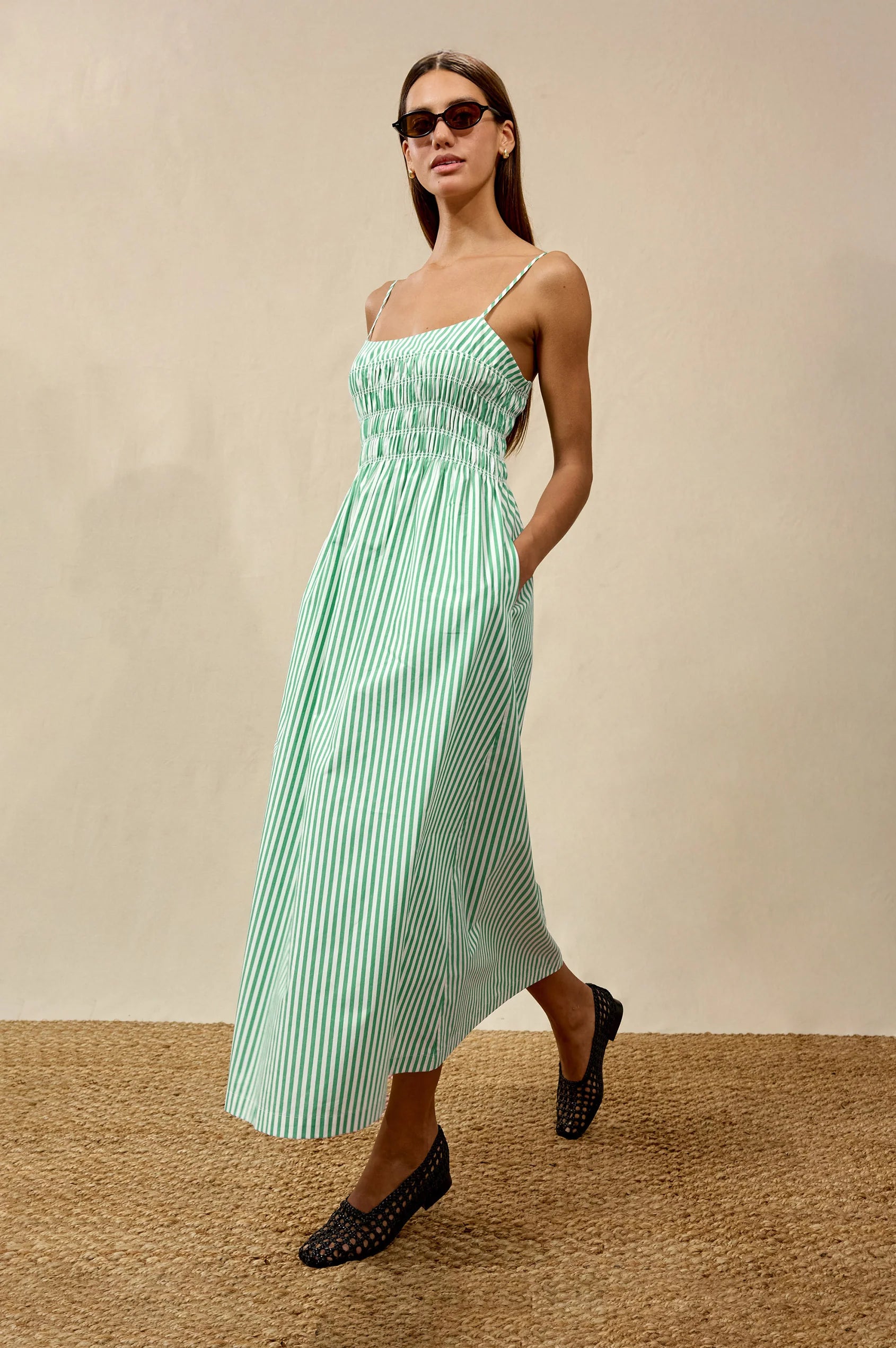 Primrose Dress front/side view, hands in pockets