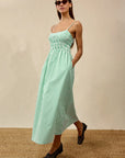 Primrose Dress front/side view, hands in pockets