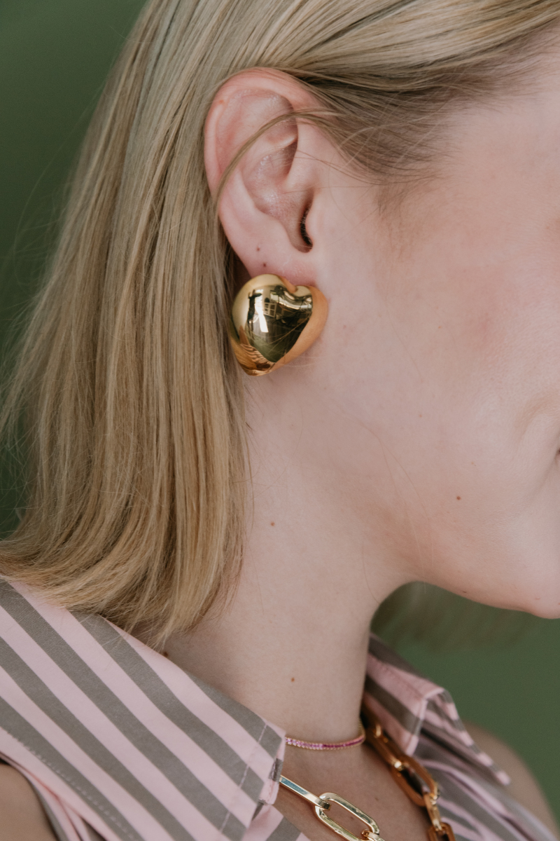 Adriana Pappas Puffed Heart Studs in Gold on model