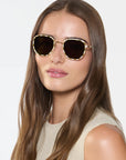 Pascal 12k Titanium + Oki Yuzu Sunglasses on model with wide, heart face shape