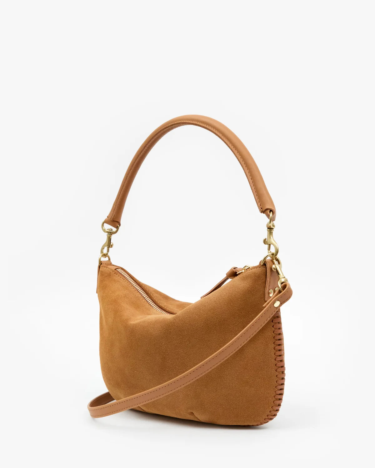 A camel brown suede shoulder bag with a curved top handle, a detachable shoulder strap, and gold-tone hardware, shown against a plain white background.