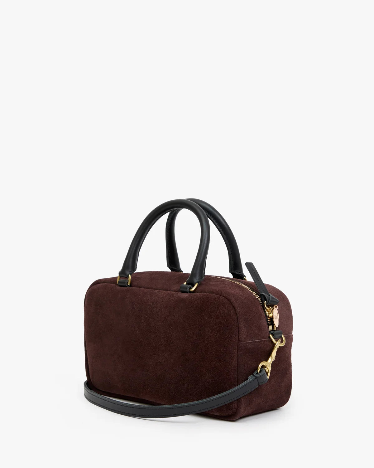 A dark brown suede handbag with black leather handles and a matching shoulder strap, accented by gold-tone hardware, shown against a plain white background.
