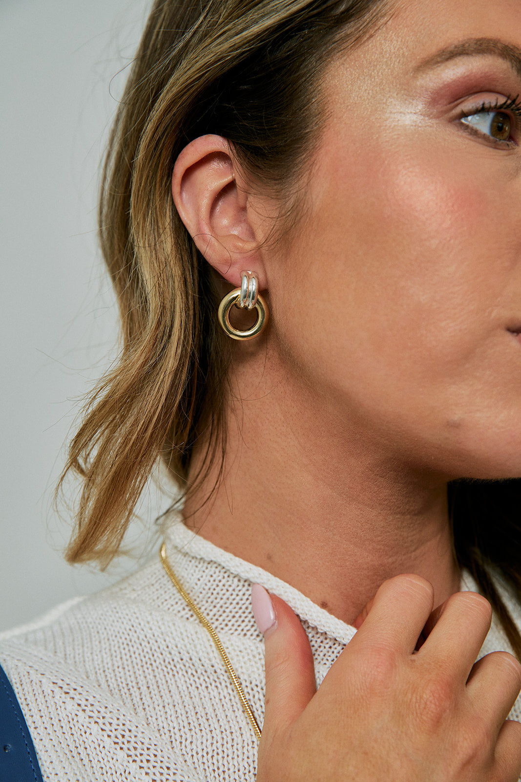 Gina 1" Earrings Two Tone close up on model