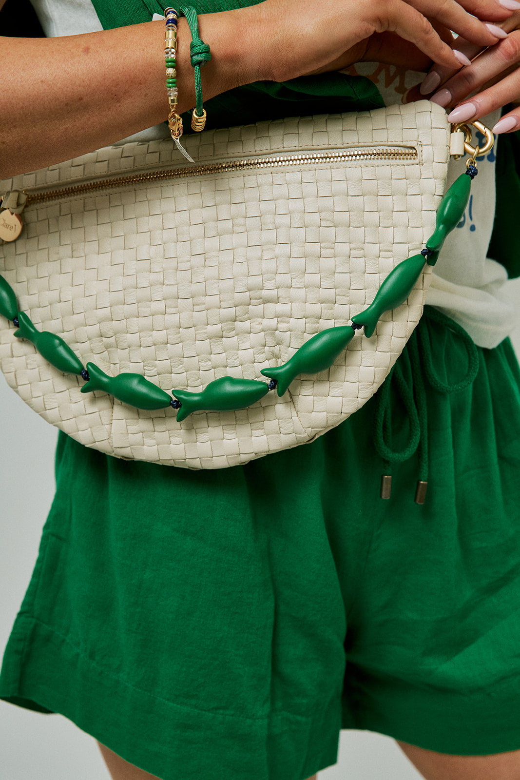 Grande Fanny Woven Checker Cream close up with green sardine strap