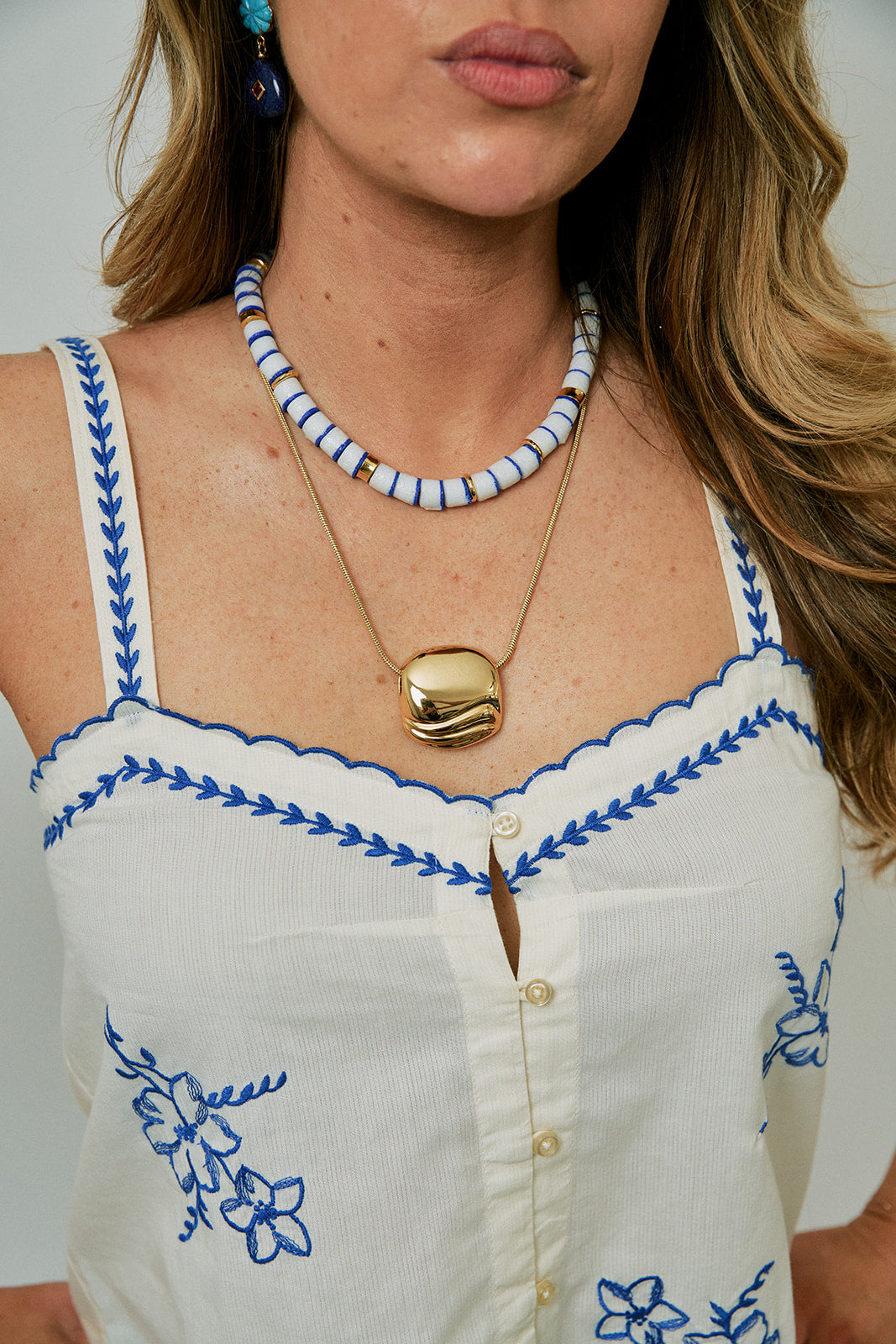 Lido Necklace in Deep Blue with gold necklace and Space Earrings