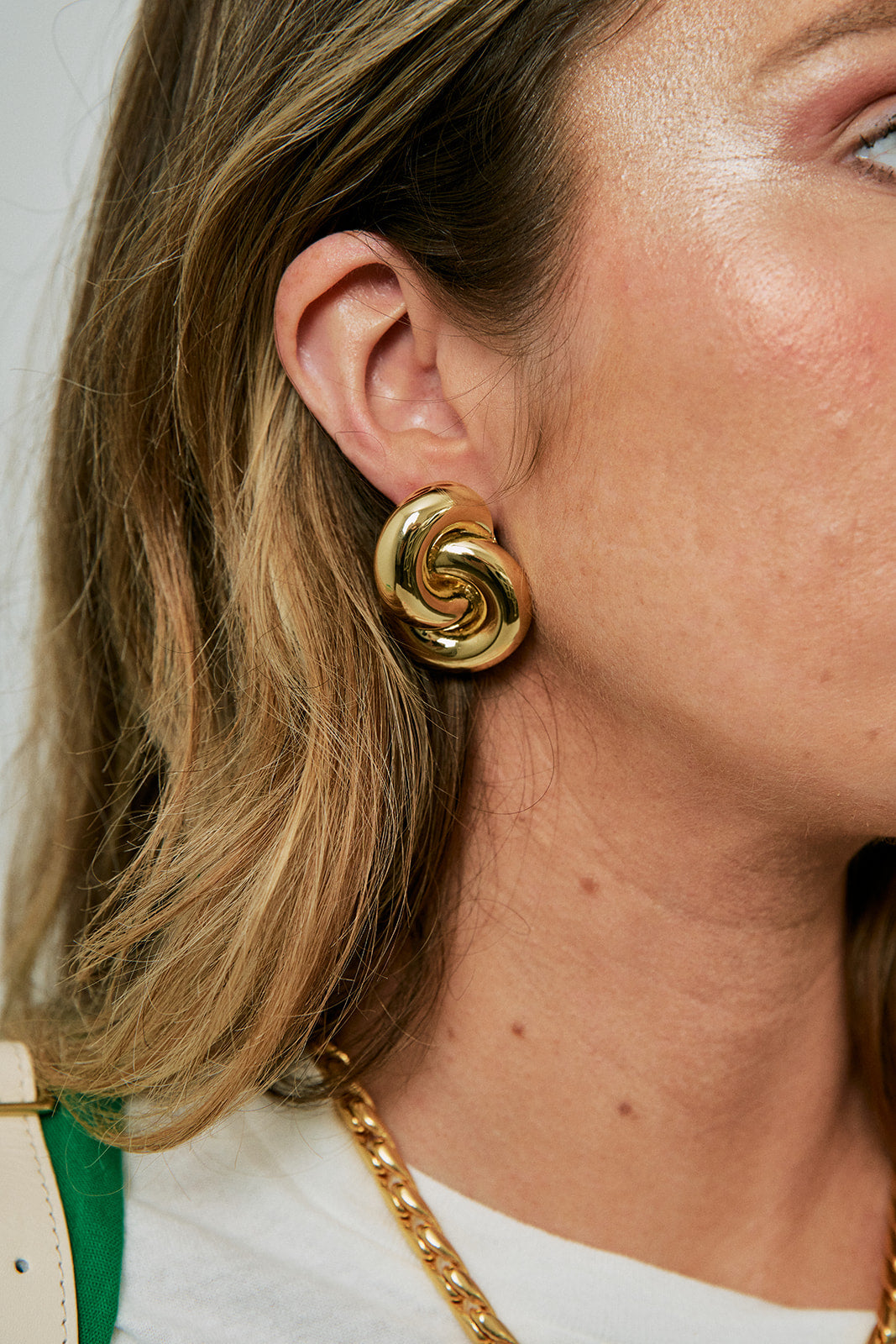 Amina Earrings in Gold on model