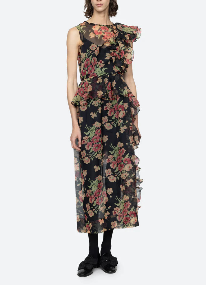 Woman wearing a floral dress on a white background